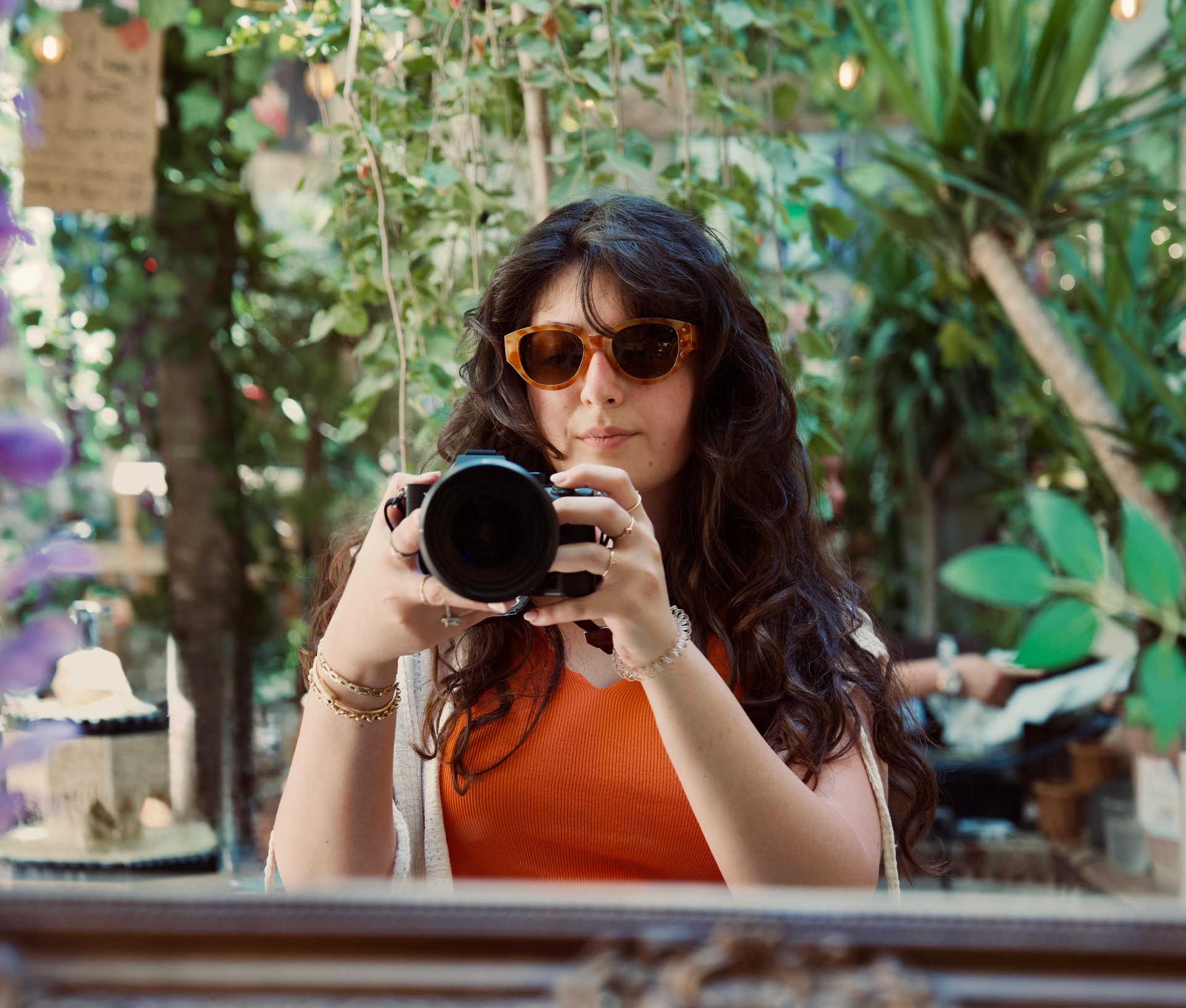 Ayah — Cairo-based photographer, holding a camera